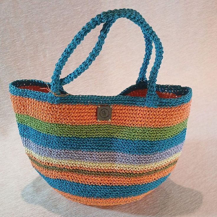 The Perfect Companion for Sunny Days ☀️️ Elevate your style with our handmade crochet tote bag made from natural paper yarn!  Perfect for the beach, picnics, or everyday use, this stylish bag is both lightweight and durable. Its spacious interior allows you to carry your personal belongings and small snacks with ease. A wonderful gift option to make your loved ones happy on special occasions!  Whether it's Mother's Day or Valentine's Day, show your love with this meaningful present. ❤️ Features: Fair Trade Tote Bag For Vacation, Multicolor Jute Shoulder Bag For Beach, Fair Trade Jute Crochet Bag For Everyday, Everyday Fair Trade Jute Crochet Bag, Casual Orange Bucket Crochet Bag, Bohemian Green Shoulder Bag For Everyday, Casual Orange Crochet Bucket Bag, Fair Trade Natural Beach Bag, Eco-friendly Crochet Bucket Bag With Adjustable Strap