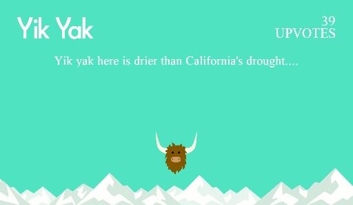 an animal with long horns standing in front of snow covered mountains and the words yik yak above it