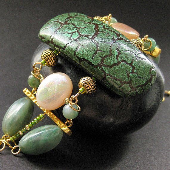 Statement Bracelet. Beaded Bracelet. Green Bracelet with Hints of Gold - Esoteric. Handmade Bracelet Unique Green Beaded Bracelets With Natural Stones, Green Gemstone Beaded Bracelets, Elegant Green Bracelets With Spacer Beads, Elegant Green Bracelet With Spacer Beads, Green Gemstone Beads For Jewelry Making, Elegant Handmade Green Beaded Bracelets, Green Beaded Bracelets With Natural Stones, Green Gemstone Beads Bangle Bracelet, Green Beaded Bracelets With Natural Stones For Jewelry Making