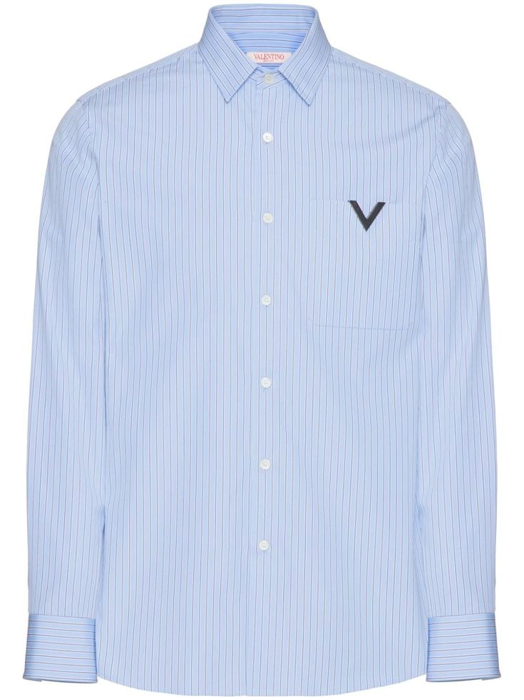 Valentino Ready To Wear blue cotton poplin texture vertical stripe pattern pointed flat collar front button fastening long sleeves buttoned cuffs chest patch pocket curved hem The full look includes Valentino Garavani accessories. Blue Shirt With Signature Stripes For Work, Blue Vertical Stripe Shirt For Work, Blue Vertical Striped Shirt For Work, Blue Striped Shirt For Work, Workwear Button-up Shirt With Signature Stripes, Button-up Shirt With Signature Stripes For Work, Designer Business Shirt For Spring, Valentino Ready To Wear, Valentino Shirt