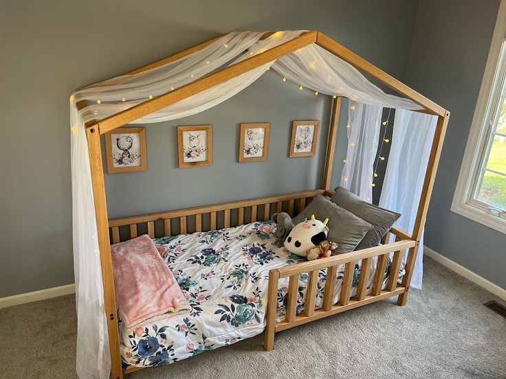 a child's bed with a canopy over it