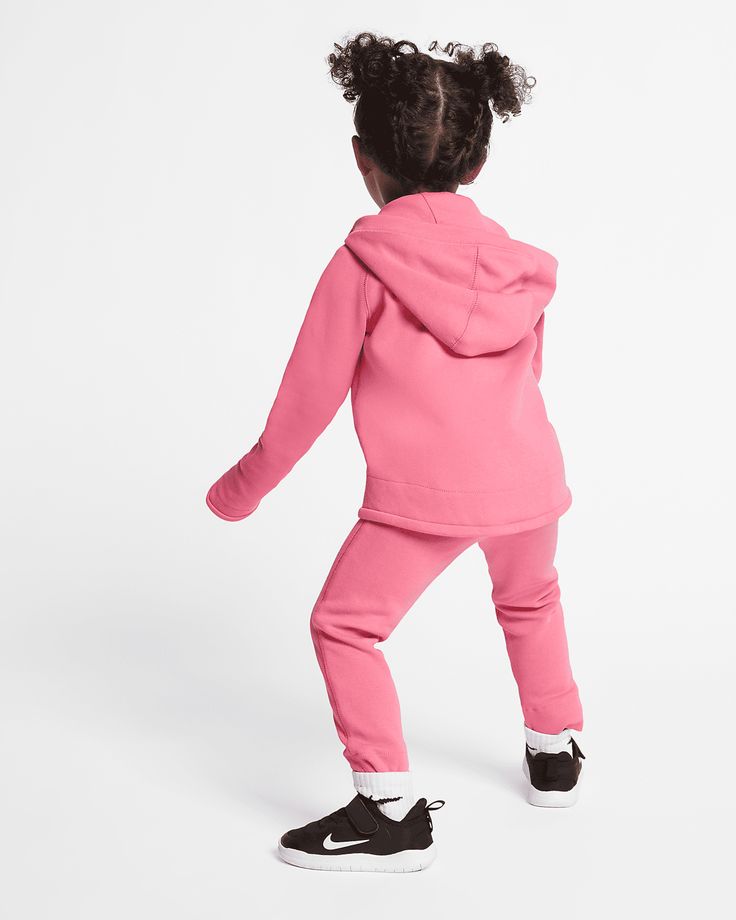 Stay stylish and comfortable with our Kid's Sportswear Tech Fleece Outfit. Made with high-quality fleece material, this outfit provides superior warmth and softness. Perfect for active kids, the moisture-wicking technology keeps them dry and comfortable during all their adventures. Upgrade your child's wardrobe today! More Details Color: Pink Style: 26D736-A5K Moisture-wicking Fleece Tracksuit For Jogging, Moisture-wicking Fleece Tracksuit For Sportswear, Sporty Pink Fleece Joggers, Sporty Fleece Tracksuit For Sports, Nike Activewear With Drawstring Hood For Gym, Nike Sportswear Tracksuit For Sports, Pink Joggers With Ribbed Cuffs For Jogging, Fleece-lined Athleisure Activewear For Sports, Pink Joggers With Ribbed Cuffs