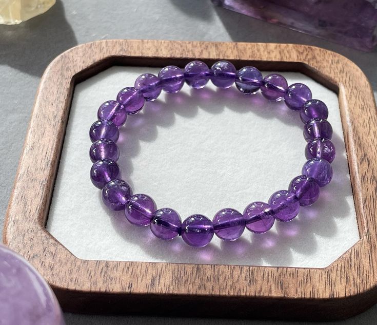 ✨ Product Details: Gemstone: Brazilian Amethyst (February Birthstone) Bead Size: Approximately 7.5mm Bracelet Style: Stretch / Elastic (Fits Most Wrists) Materials: Natural Amethyst Beads, Durable Elastic Cord Origin: Ethically sourced from Brazil Packaging: Beautifully packaged, perfect for gifting Celebrate the beauty of February's birthstone with this handcrafted Brazilian Amethyst bracelet.  Featuring luxurious 7.5mm beads, this bracelet showcases the captivating deep purple hues that make a February Birthstone Jewelry, February Birthday, Bracelet Crystal, Jewelry Crystal, February Birthstone, Amethyst Bracelet, Amethyst Beads, February Birth Stone, Crystal Gifts