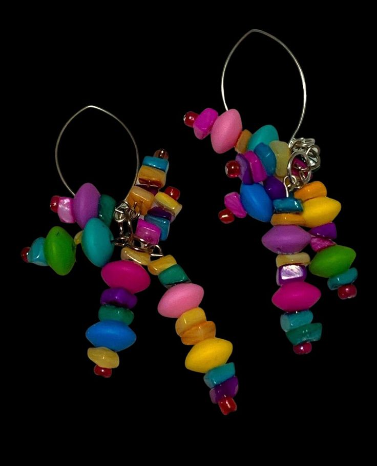 Brightly colored Marquis earrings, hand beaded with a rainbow of bead clusters. Fun and flirty, these unique earrings make a bold statement for anyone. Unique Multicolor Large Beads Earrings, Unique Multicolor Earrings With Large Beads, Handmade Whimsical Multicolor Beaded Earrings, Whimsical Multicolor Handmade Beaded Earrings, Whimsical Handmade Multicolor Beaded Earrings, Funky Colorful Beaded Jewelry, Handmade Multicolor Clip-on Earrings For Party, Fun Colorful Beaded Dangle Earrings, Fun Dangle Earrings With Colorful Beads