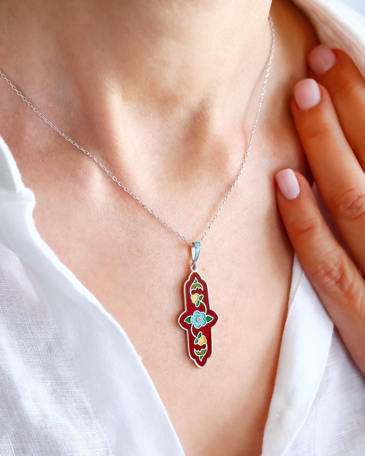 Adorn yourself with timeless elegance with this breathtaking Handcrafted Cloisonné Enamel necklace featuring an exquisite Anatolian Floral Motif. The intricate design is showcased on a lustrous 925 Sterling Silver pendant, making it a truly unique piece that will elevate any outfit. Each vibrant enamel detail is meticulously crafted by hand, ensuring a truly one-of-a-kind accessory that exudes craftsmanship and sophistication. Make a statement with this stunning necklace that seamlessly blends t Fine Jewelry With Inlay As A Gift, Elegant Round Pendant Necklace With Inlay, Elegant Silver Necklace With Inlay, White Necklace With Inlay For Gift, Elegant Necklace With Round Pendant Inlay, Elegant Inlay Necklaces For Gift, White Pendant Necklace With Inlay, Elegant Silver Inlay Necklaces, Elegant Silver Inlay Necklace