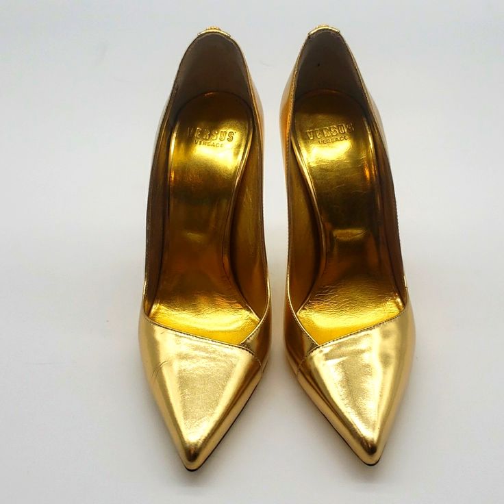 Versus Versace Gold 3 1/2 Inch Heels Size 39 Color Gold Condition New Never Been Worn 100% Authentic I Dont Sell Fake Brands All Items Can Be Verified At Store Locations Condition New Luxury Gold Court Shoes With 4-inch Heel, Classic Gold Closed Toe Heels, Gold Court Shoes With Branded Heel Counter, Gold Court Shoes With Branded Heel, Classic Gold Pointed Toe Court Shoes, Gold High Heel Office Shoes, Classic Gold Heels With Padded Heel, Gold Heels With Sculpted Heel For Galas, Classic Gold Court Shoes For Formal Occasions