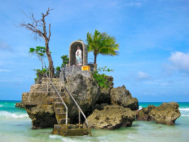 an island with stairs leading to the beach