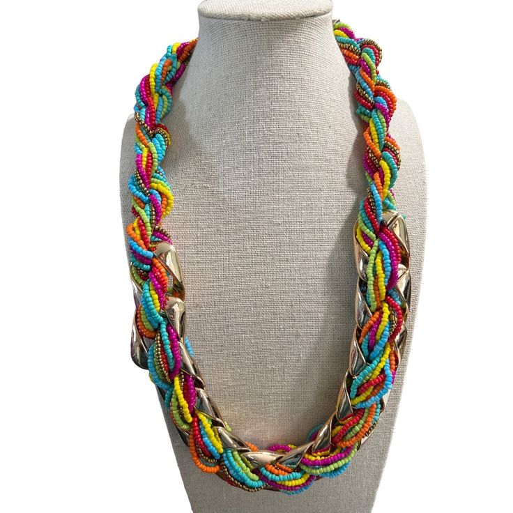 Double Strand Multi-Color Seed Bead And Metal Necklace -- 24". This necklace has a double strand made up of Six strands of glass beads: Orange, Blue, Red, Green, Pink, and Bronze. These strands are fed through an open gold-tone metal link, Measurements: Length: 24; Width: 1-1/2"; Extender: 3"0 Multi-strand Glass Necklace With Colorful Beads, Multi-strand Glass Beaded Colorful Necklace, Multi-strand Glass Bead Colorful Necklace, Colorful Multi-strand Glass Bead Necklaces, Multicolor Multi-strand Jewelry For Party, Adjustable Multicolor Long Necklace With Colorful Beads, Multicolor Multi-strand Party Jewelry, Glass Multi-strand Necklace With Colorful Beads, Multicolor Multi-strand Costume Jewelry Beads