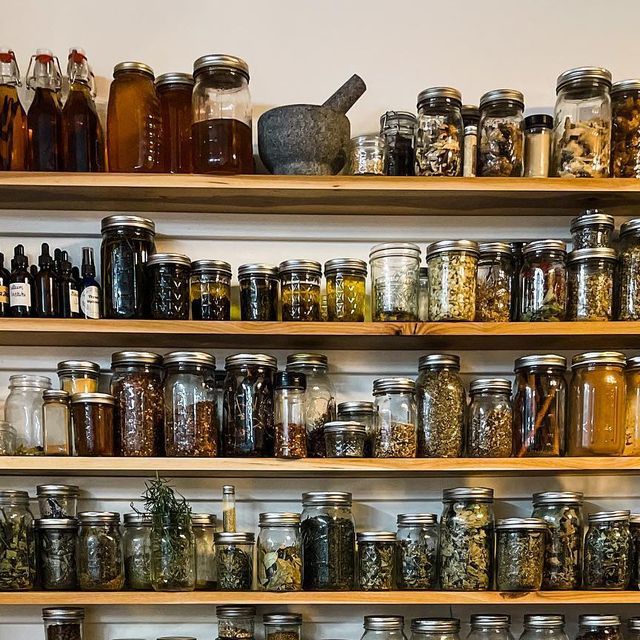 shelves filled with lots of different types of jars