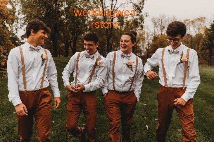 a group of young men standing next to each other on top of a grass covered field