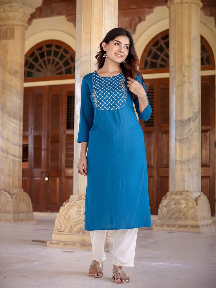 A charming blue and rayon kurta, meticulously adorned with yoke design & Chikankari detailing. The straight shape enhances its elegant silhouette, making it a perfect blend of traditional craftsmanship and contemporary style. Single Piece Fabric: Rayon Color: Blue Neck: Round Neck Sleeve: 3/4th Sleeves Style - Straight Shape with Regular Style Work Done: Yoke Design with Chikankari Detailing Length - Calf Length Washing Instructions: Hand Wash Size & Fit - Model's height is 5'8 wearing size smal Yoke Design, Sleeves Style, Womens Size Chart, Single Piece, Washing Instructions, Contemporary Style, Sleeve Styles, Fitness Models, Round Neck