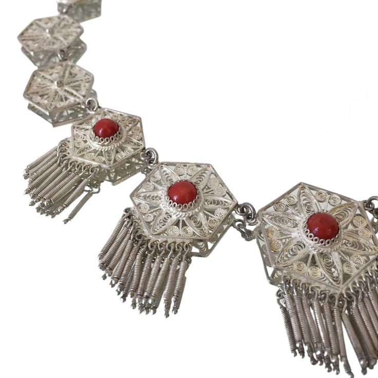 Exquisite delicate vintage filigree necklace in bright silver-tone metal with round red cabochons (stone or glass) circa 1970s  Length: 38.5 cm / 15.1 '' Width: up to 3.8 cm / 1.5 '' Weight: 31.7 grams Beautiful vintage condition, with some minor patina Shipping will be charged only once when ordering multiple items from my shop More quality vintage items in my Etsy shop: https://www.etsy.com/shop/styled64 Festive Silver Filigree Necklaces, Elegant Filigree Necklaces For Festivals, Elegant Festival Filigree Necklaces, Vintage Adjustable Filigree Necklace, Adjustable Vintage Filigree Necklace, Adjustable Vintage Filigree Necklaces, Formal Red Necklaces With Intricate Design, Formal Red Necklace With Intricate Design, Ornate Filigree Necklaces For Festivals