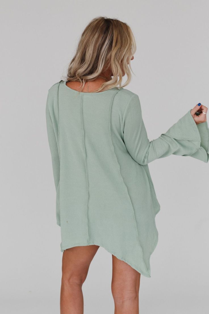 Step into the enchanting Golden Hour Long Bell Sleeve Top and embrace the boho vibes! Whether you're strolling through a festival or enjoying a casual day out, this top will add a touch of bohemian magic to your outfit because it features: Comfortable mini ribbed knit fabric Relaxed and loose silhouette for effortless style Flattering v - neckline Loose long bell sleeves for a whimsical look Exposed seams throughout create a unique boho aesthetic Cute uneven bottom edge detail adds an extra touc Bell Sleeves Design, Lisa Fischer, Boho Outfit, Exposed Seams, Boho Aesthetic, Flowy Top, Flounce Sleeve, Ribbed Texture, Flowy Tops