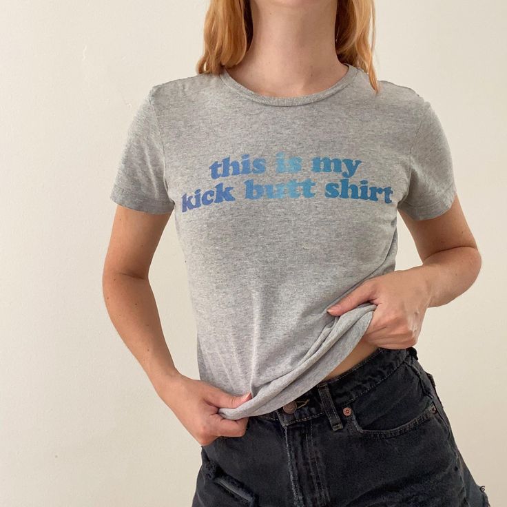 Graphic tee with sassy quote. Full length, but would make a cute baby tee if you wanted to crop it.  Pre-loved item. Good vintage condition. Brand: Nike Size on tag: Women's S. See measurements. Chest: 34" Length: 22.5" Shoulders: 14" Sleeves: 6" Please allow 0.5" margin of error for measurements, they are taken by hand. Model is 5'4" and usually wears a size small. Material: 90% cotton, 10% polyester. Wash: Machine wash cold. Tumble dry low. Made in: Mexico. Trendy Cotton T-shirt With Quote Print, Fitted Fun T-shirt With Text Print, Funny Cotton Tops With Quote Print, Funny Quote Print Crew Neck Top, Fun Fitted T-shirt With Text Print, Cotton Slogan Cropped T-shirt With Crew Neck, Fitted Fun T-shirt With Letter Print, Casual Short Sleeve Tops With Quote Print, Cotton Short Sleeve Tops With Quote Print