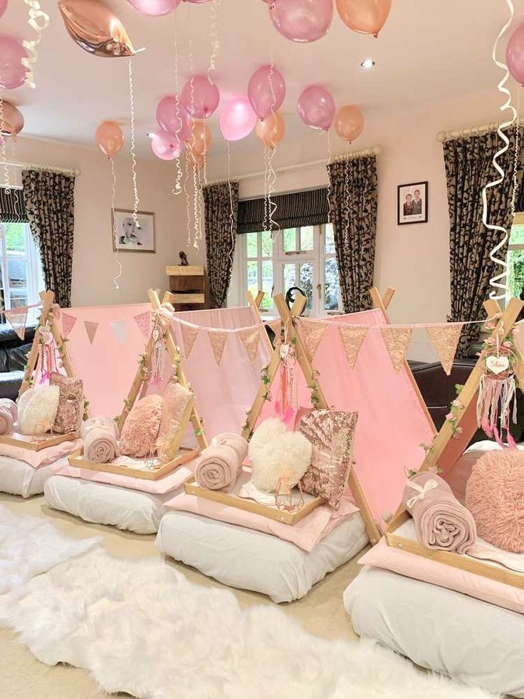 a room with pink and white decorations on the walls