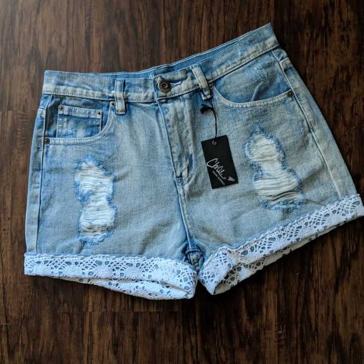 * Brand New - Never Worn 100% Cotton Super Cute! Light Wash Denim Shorts With Distressing And Crocheted Lace Trim On Bottom Edges! Approximate Measurements Waist : 14" Light Wash Denim Shorts, Crocheted Lace, Light Wash Denim, Crochet Lace, Jean Shorts, Lace Trim, Denim Shorts, Super Cute, Womens Sizes