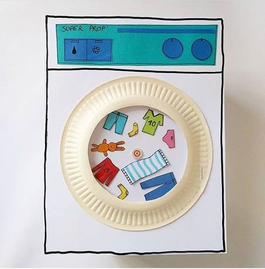 a paper plate with cutouts of children's toys on it in the shape of a washing machine