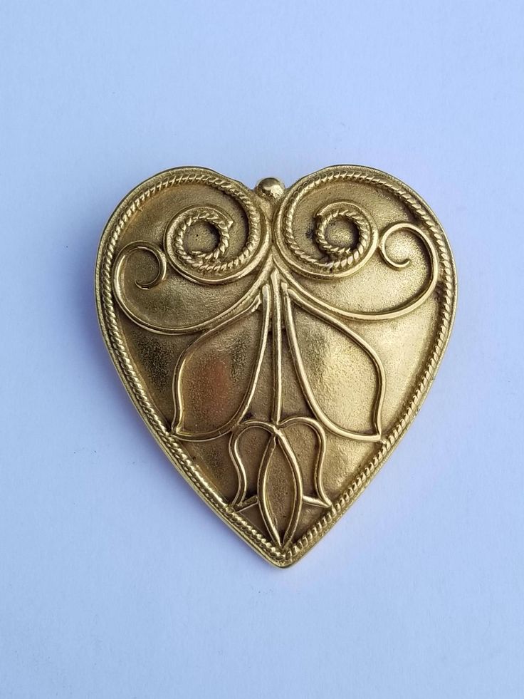 Beautiful heart shaped brooch. Costume jewelry by Metropolitan Museum of Art.  Feel free to ask questions. Thank you for visiting our shop! Gold Art Nouveau Brooch For Collectors, Gold Art Nouveau Brooches For Gift, Handmade Brass Gold Brooches, Art Nouveau Gold Brooches As Gift, Handmade Gold Brass Brooches, Antique Gold Brass Brooch For Gift, Victorian Gold Brooch For Gift, Victorian Gold Brooch Gift, Victorian Gold Brooches As Gift