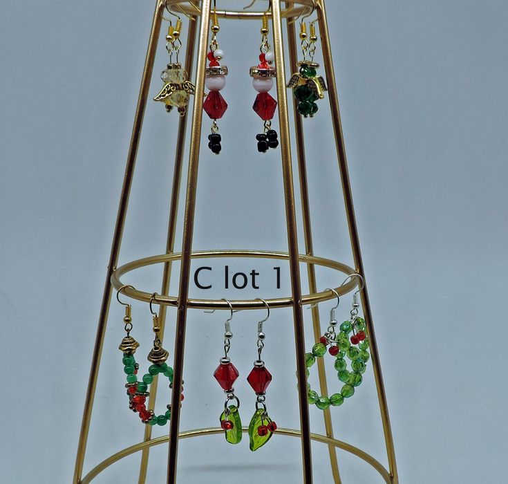 Earrings to make this holiday season shine. A variety of themes and charms celebrate Christmas and other holidays. Themes include weather, holly, angels and Santa. Christmas Celebration Jewelry With Matching Earrings, Holiday Dangle Earrings With Ear Wire, Festive Christmas Jewelry With Matching Earrings, Green Dangle Christmas Jewelry, Holiday Matching Drop Earrings, Holiday Jewelry With Matching Earrings, Holiday Jewelry With Matching Drop Earrings, Christmas Dangle Jewelry For Celebration, Christmas Jewelry Gift With Matching Earrings