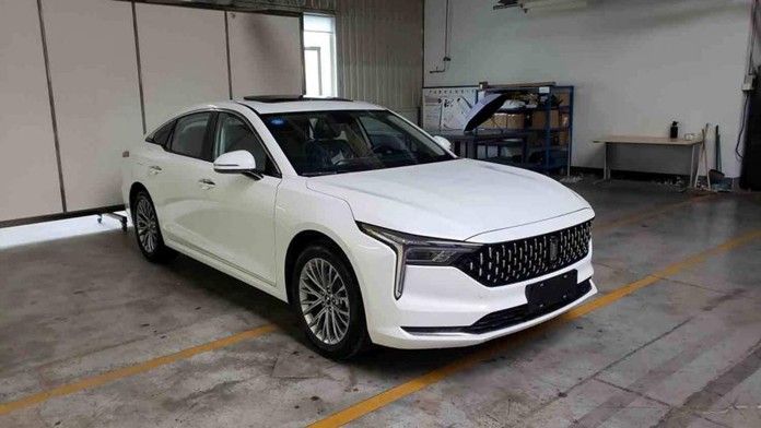 a white car is parked in a garage