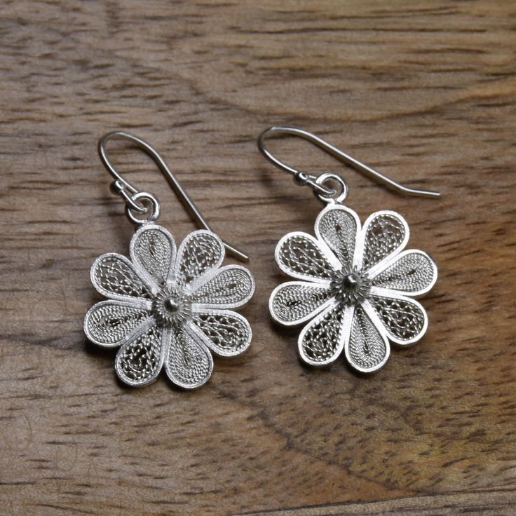 One of the most traditional pieces in filigree are these beautiful flowers. ultra-lightweight Each piece is distinctive Hand fabricated Gold is gold plated 18k over sterling silver Dimensions: 1.10"L x 0.58"W Jewelry Filigree Flower Earrings, Delicate White Gold Jewelry With Intricate Design, Traditional Flower-shaped Earrings, Filigree Flower Drop Earrings, Traditional Gold Flower Earrings, Traditional Flower Shaped Jewelry, Traditional Flower Earrings With Intricate Design As Gift, Traditional Flower Earrings With Intricate Design For Gift, Traditional Sterling Silver Flower Earrings