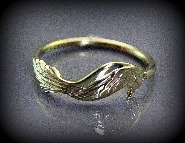 This ring is made with solid gold and can be ordered in 10 k yellow gold or 14 k. The bird represent a unique and beautiful phénix.  The phoenix is a fabulous bird endowed with longevity and characterized by its power to be reborn from its ashes. It is a beautiful symbol of revival and hope for all because we have all this capacity; we each lived transformations, experiences which made us growth and such the phoenix let us have reborn from our ashes. This mythological bird inspired me to create thisring because of its deep meaning with its grace and its symbolism. The thread ring mesure 1.5 mm and the bird width is 7 mm Because the environment means a lot to me just like you, all my jewelry is sent with the recyclable material, such as paper bags and boxes of jewels made with 100% recycled Phoenix Ring, Thread Ring, Phoenix Jewelry, Bird Ring, Bird Rings, Beautiful Symbols, Phoenix Bird, Solid Gold Ring, Deep Meaning