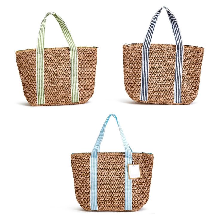 three straw bags with handles and straps on each side, one has a blue stripe