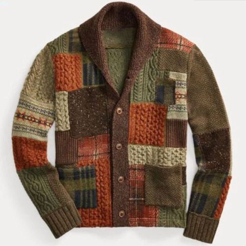 a jacket that is sitting on top of a white surface with an orange and green patchwork pattern