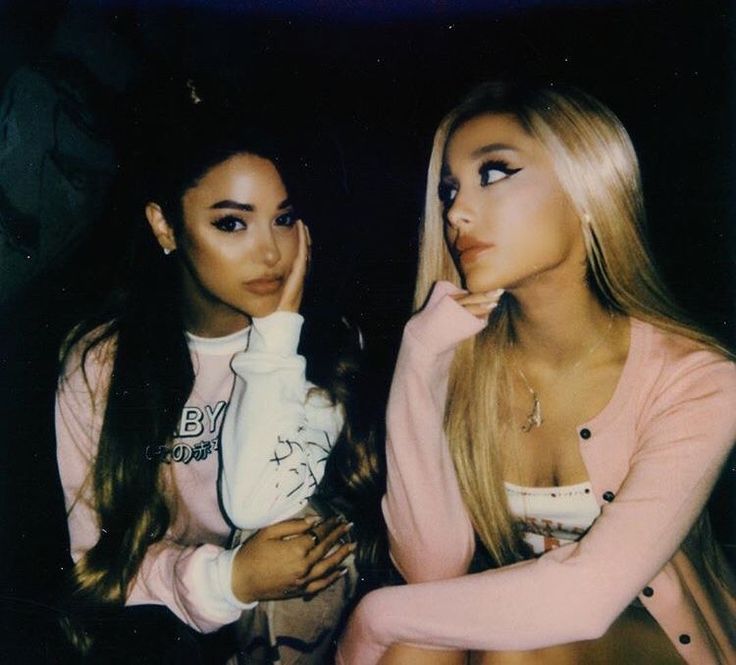 two young women sitting next to each other