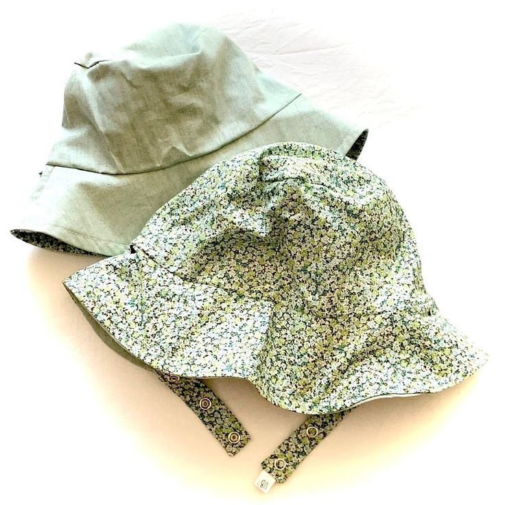 Please visit our website for more selection. Did you know ALL of our hats are rated UPF 50+? Our exclusive full circle sun protection-- along with a UPF 50+ rating-- makes our buckets superior to others. Plus, they're reversible! The straps slide through slots so you can use BOTH sides! ROCK ON! like all of our hats, this one is reversible, machine washable and made to last 'till the next generation. handmade in USA. Looking for full-circle sun protection? Look NO FURTHER! Our bucket hats featur Urban Baby, Bucket Hat Fashion, Beach Play, Wooly Hats, Yellow Springs, Summer Sun Hat, Winter Cap, Organic Cotton Baby, Rock On