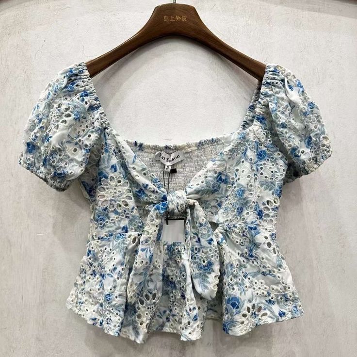 This En Saison Blouse Is Guaranteed Authentic. It's Crafted With 100% Cotton. Style Type: Blouse Collection: En Saison Sleeve Length: Closure: Material: 100% Cotton Fabric Type: Cotton Specialty: Printed Cropped Blue Blouse For Summer, Cropped Blue Floral Print Blouse, Blue Floral Print Cropped Blouse, Blue Cropped Blouse With Floral Print, Light Blue Cropped Summer Blouse, Light Blue Cropped Blouse For Summer, Blue Cropped Ruffle Top, Blue Puff Sleeve Top With Ruffles, Light Blue Feminine Blouse For Summer