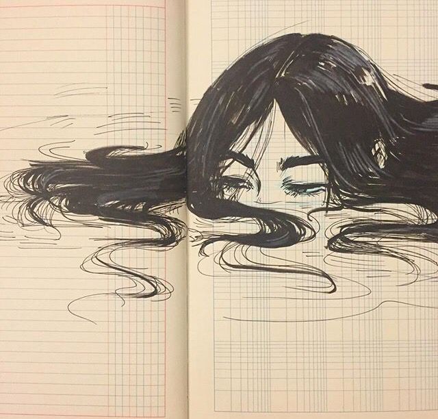 an open book with a drawing of a woman's face and hair in the water