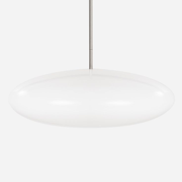 a white light hanging from a ceiling fixture