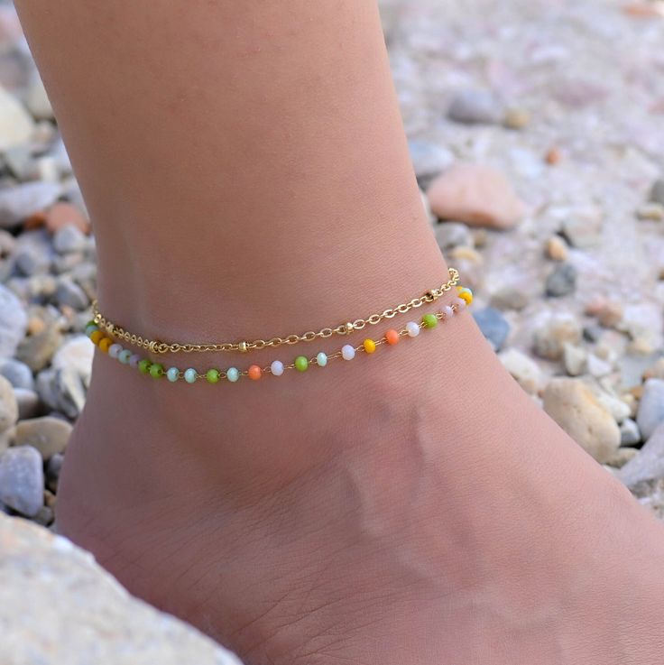 This gold Satellite chain anklet is for women. Its boho style makes it a great piece of summer jewelry. The ankle bracelets have an extension so the size can be adjusted. Gold Anklets With Beads For Summer, Beaded Gold Anklets For Summer, Trendy Gold Anklets For Festivals, Gold Anklets With Round Beads For Festival, Summer Beaded Gold Anklets, Adjustable Chain Bohemian Beaded Bracelets, Colorful Beads Anklet For Festival, Gold Anklets With Round Beads For Beach, Gold Bohemian Beaded Bracelets For Summer