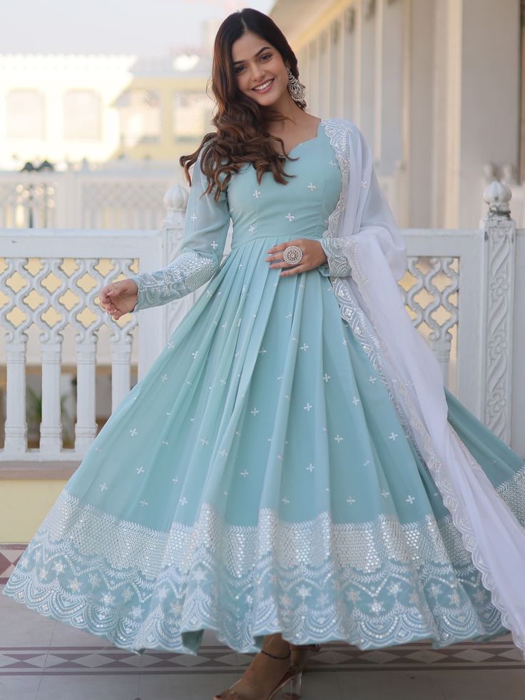 Introducing our stunning "fascinating sky-blue embroidered georgette function wear gown", a must-have addition to your ethnic wear collection. This exquisite gown features intricate sequin work and thread embroidery, adding a touch of glamour and elegance to your look. The sky-blue color is perfect for any festive occasion, event, or function, making you stand out in the crowd.
Made from high-quality georgette fabric, this fully stitched gown is available in sizes ranging from XS to XXL, ensurin डिजाइनर कपड़े, Blue Anarkali, Georgette Anarkali, Gown With Dupatta, Designer Gown, Bollywood Lehenga, Exquisite Gowns, Anarkali Gown, Party Kleidung