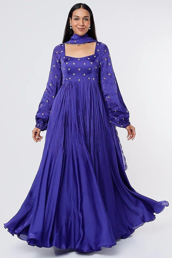 Midnight Blue Satin Organza Anarkali Set Featuring a royal blue anarkali in satin organza with floral butti embroidery. It is paired with a matching viscose organza dupatta. This product will be shipped to you after 1-2 weeks from the date of order placed. All custom made orders are not returnable. {VARIATION MAY COME DEPENDING UPON AVALIBILITY OF LACES OR GOTTA PATI} NOTE: Visual Samples on website may differ slightly from actual product due to light & effects during photography (Length & Bread Anarkali Style Satin Dupatta With Resham Embroidery, Satin Dupatta With Resham Embroidery, Fitted Satin Dupatta With Embroidery, Fitted Embroidered Satin Dupatta, Semi-stitched Dola Silk Party Gown, Blue Party Choli In Chanderi, Blue Chanderi Choli For Party, Floor-length Georgette Churidar For Wedding, Blue Silk Floor-length Lehenga