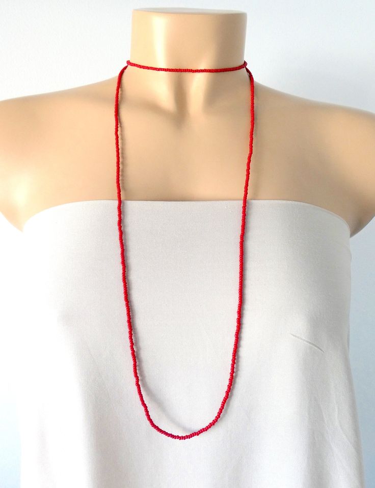 "This is a one strand beaded red necklace, with NO CLASP, and can be worn in multiple ways, as shown in pictures. ❤ SIZES This item is one size fits all. ❤ PROCESSING AND SHIPPING Most orders are made and shipped out in one business day. Please check delivery timeframes for your location on the description below. ❤ CUSTOM ORDERS If you like this item in a different color, send me a message indicating: color, size and quantity needed. I will send you a link for a \"custom order\" and you'll be ab Red Beaded Long Necklace, Red Bohemian Lariat Necklace, Handmade Red Beaded Lariat Necklace, Beach Red Beaded Choker, Red Beaded Chain Choker Necklace, Red Choker Beads For Festivals, Red Bead Choker For Festivals, Red Beaded Choker Necklaces For Festival, Red Beaded Long Necklace As Gift