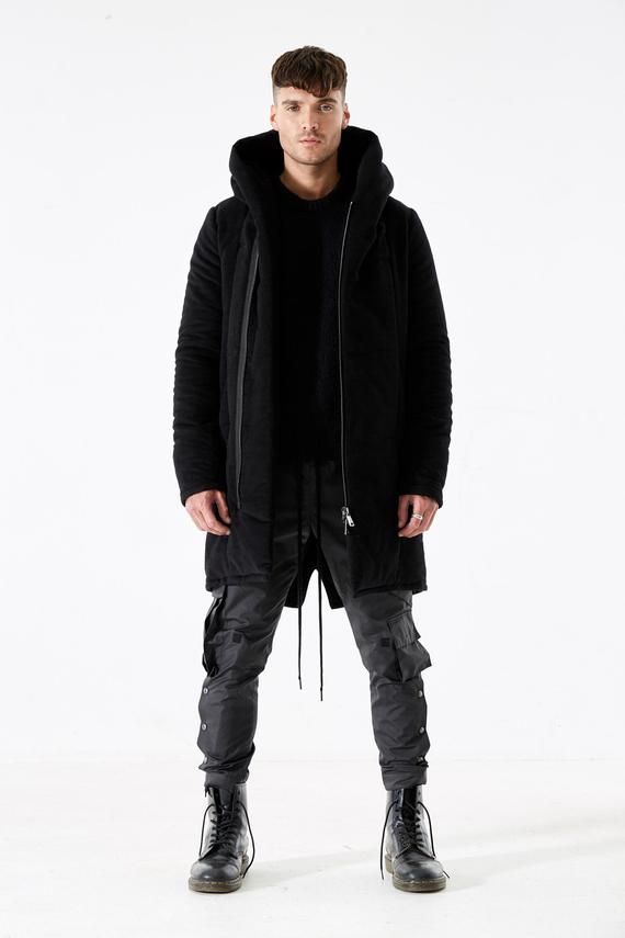 Hooded coat in black moleskin with padded lining.Gunmetal hardware, two side pockets & inside pocket.Made in London, England.Model is 6'0 and wearing size L. Fall Streetwear Parka With Double-lined Hood, Black Parka With Pockets For Fall, Black Fall Parka With Pockets, Black Urban Parka With Pockets, Black Winter Outerwear With Side Pockets, Black Double-lined Hood Parka For Streetwear, Techwear Style Parka With Pockets For Cold Weather, Urban Black Parka With Double-lined Hood, Black Winter Parka With Double-lined Hood