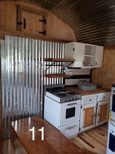 a kitchen area with an oven, stove and refrigerator