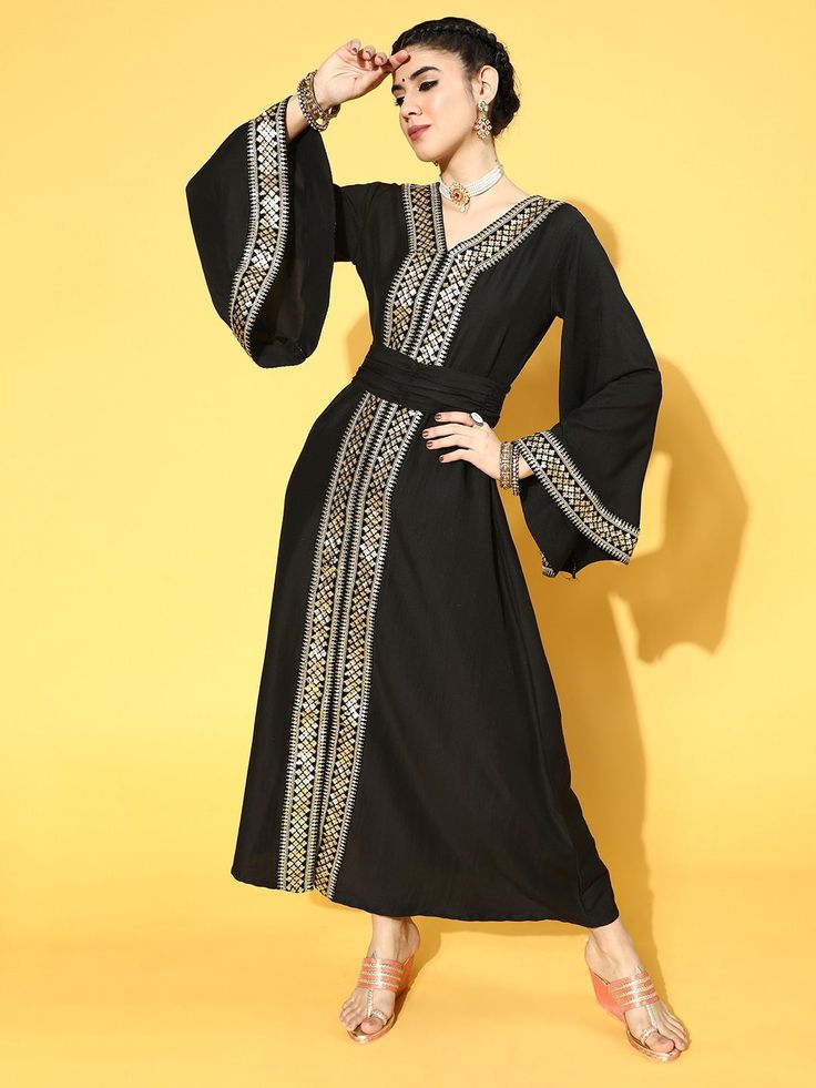 Buy beautiful black poly silk partywear ethnic motifs dresses online at best price from Inddus with free shipping. Traditional Black Maxi Dress For Festive Occasions, Elegant Maxi Dress For Navratri Party, Elegant Party Maxi Dress For Navratri, Traditional Black Maxi Dress, Traditional Black Maxi Length Dress, V-neck Party Dress For Navratri, Traditional Maxi Dress For Navratri Party, Traditional Black Floor-length Dress, Traditional Black Fitted Dress