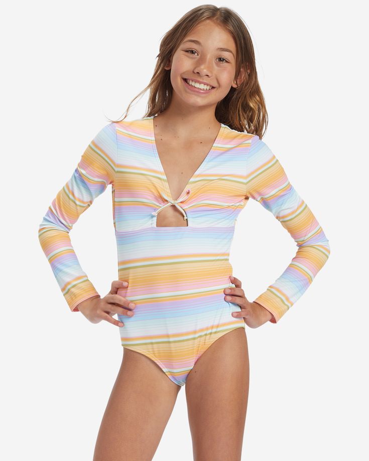 Crafted of a recycled elastane-blend fabric for sun protection, softness, and stretch, this girl's long-sleeve swimsuit from Billabong's Blissed Out Collection stands out from the rest with a V-neck, front knot, and a bold striped design. Billabong Kids, Billabong Girls, Surf Tee, Long Sleeve Swimsuit, 1 Piece Swimsuit, Running Fashion, Swimwear Girls, Shorts With Tights, Rain Wear