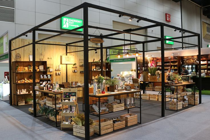 the inside of a store with shelves filled with plants and other things on display in it