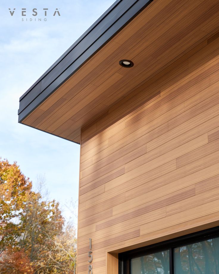 an exterior view of a house with wood siding