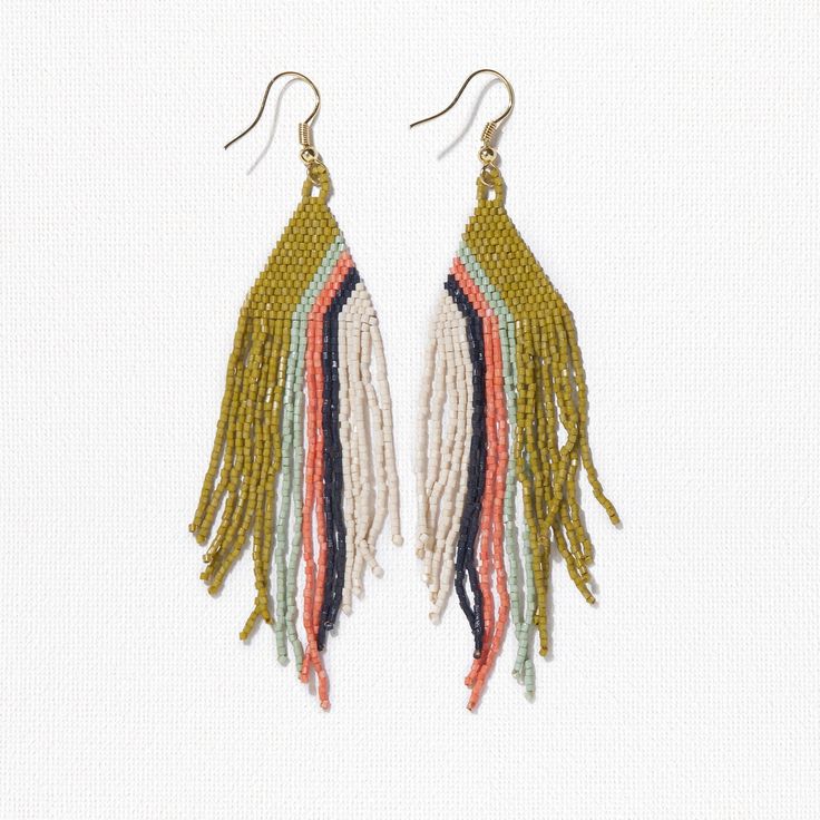 Our precision-cut glass Luxe beads in a daringly groovy colorway are just what your jewelry box is missing. Citron, mint, coral, navy + ivory beads are handwoven into a triangle shape with a modern diagonal stripe design that brings boho style to life in an approachable way. Flowy fringe takes these statement earrings to a whole new level with movement that turns heads with any outfit. Life is short - accessorize boldly. Citron, Mint, Coral + Navy Colors 4"L Made By Artisans In India Glass + Bra Adjustable Geometric Beaded Jewelry, Handmade Multicolor Geometric Jewelry, Adjustable Triangular Beaded Jewelry, Adjustable Triangle Beaded Jewelry, Handmade Geometric Multicolor Jewelry, Multicolor Beaded Geometric Earrings, Unique Multicolor Geometric Jewelry, Mint Coral, Striped Earrings