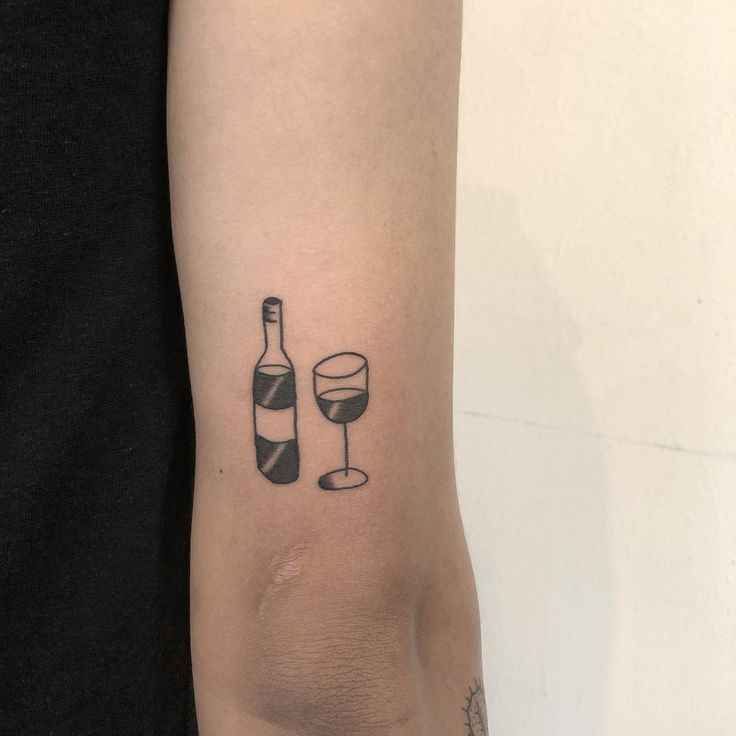 Wine bottle and glass tattoo by yeahdope inked on the right triceps Wine Tattoos, Wine Glass Tattoo, Wine Tattoo, Glass Tattoo, Plane Tattoo, Unique Tattoos For Men, Tato Minimal, Wallpaper Matching, Cup Tattoo