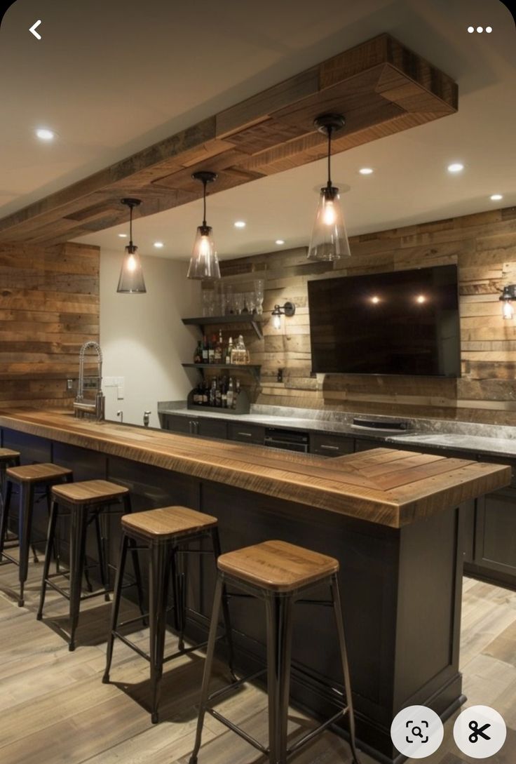 an image of a kitchen setting with bar stools and wood paneling on the walls