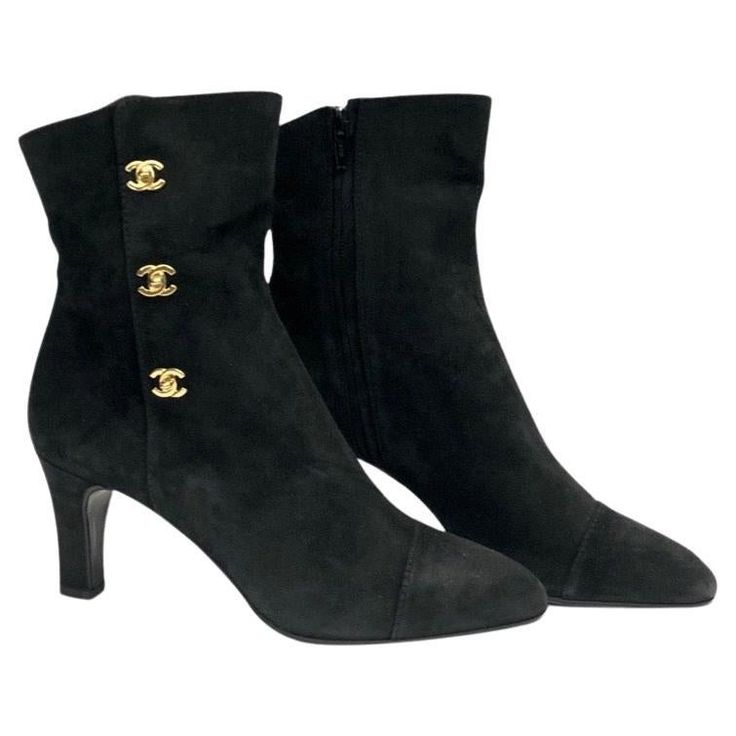 - Chanel black suede ankle boots. A classic collectable item! - Gold Hardware CC turn-lock style. - Side zip closure. - Size 37. Luxury Winter Ankle Boots, Luxury Black Lace-up Cap Toe Boots, Chic Luxury Boots, Luxury Black Boots For Work, Luxury Black Heeled Boots, Luxury Black Boots With Zipper Closure, Chic Luxury Ankle Boots, Chic Luxury Boots With Zipper Closure, Luxury Classic Ankle Boots