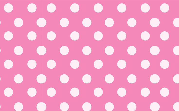 a pink background with white polka dots