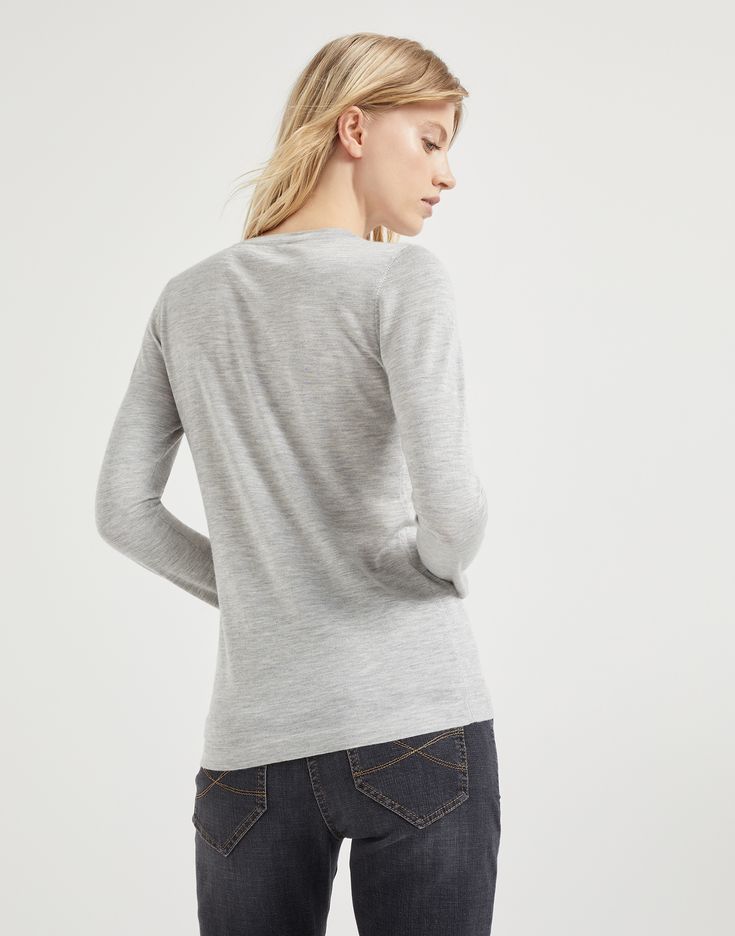 Cashmere and silk lightweight sweater The excellence of Brunello Cucinelli materials elevates the essential flavor of this cashmere and silk Sparkling yarn sweater. The lightweight, soft yarn combines the refined qualities of the natural fibers with a lamé thread which spreads delicate metallic reflections along the surface. Both regular and comfortable proportions are offered by the fit. Elegant Long Sleeve Merino Wool V-neck Sweater, Elegant Long Sleeve Fine Knit V-neck Sweater, Elegant Merino Wool Long Sleeve V-neck Sweater, Elegant Fine Knit Long Sleeve Top For Fall, Elegant Long Sleeve Fine Knit Top For Fall, Classic Cashmere Fine Knit Top, Classic Fine Knit Cashmere Top, Elegant Cashmere Crew Neck Top, Elegant Merino Wool V-neck Sweater For Layering