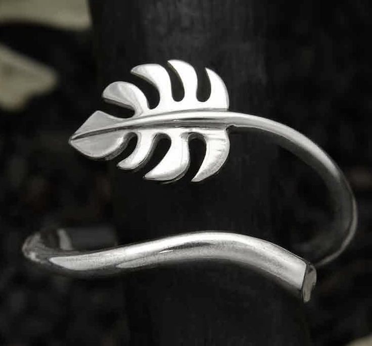 This Sterling Silver Monstera leaf ring is simple, yet unique, and flows beautifully around one's finger. The Monstera plant is a tropical beauty and in Hawaii it symbolizes prosperity, growth, success, and family happiness. As pictured, this ring is a size 7 and fully adjustable. Monstera Jewelry, Indoor Plant Gifts, Moon Jewellery, Plant Rings, Forest Jewelry, Family Happiness, Tropical Beauty, Silver Wrap Ring, Monstera Plant